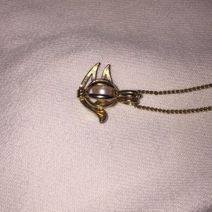 Dove with a pearl in it necklace